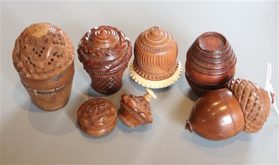 Five 19th century coquilla nut nutmeg graters and two condiment shakers, largest 7.2cm